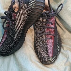 Yeezy Black and Red Athletic Shoes